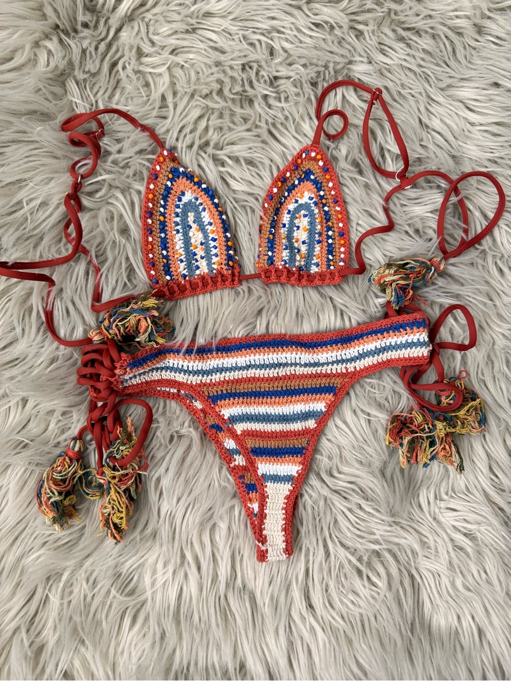 Hand-crotched bikini with orangey and blue tones Pom Pom strings& beaded detail
